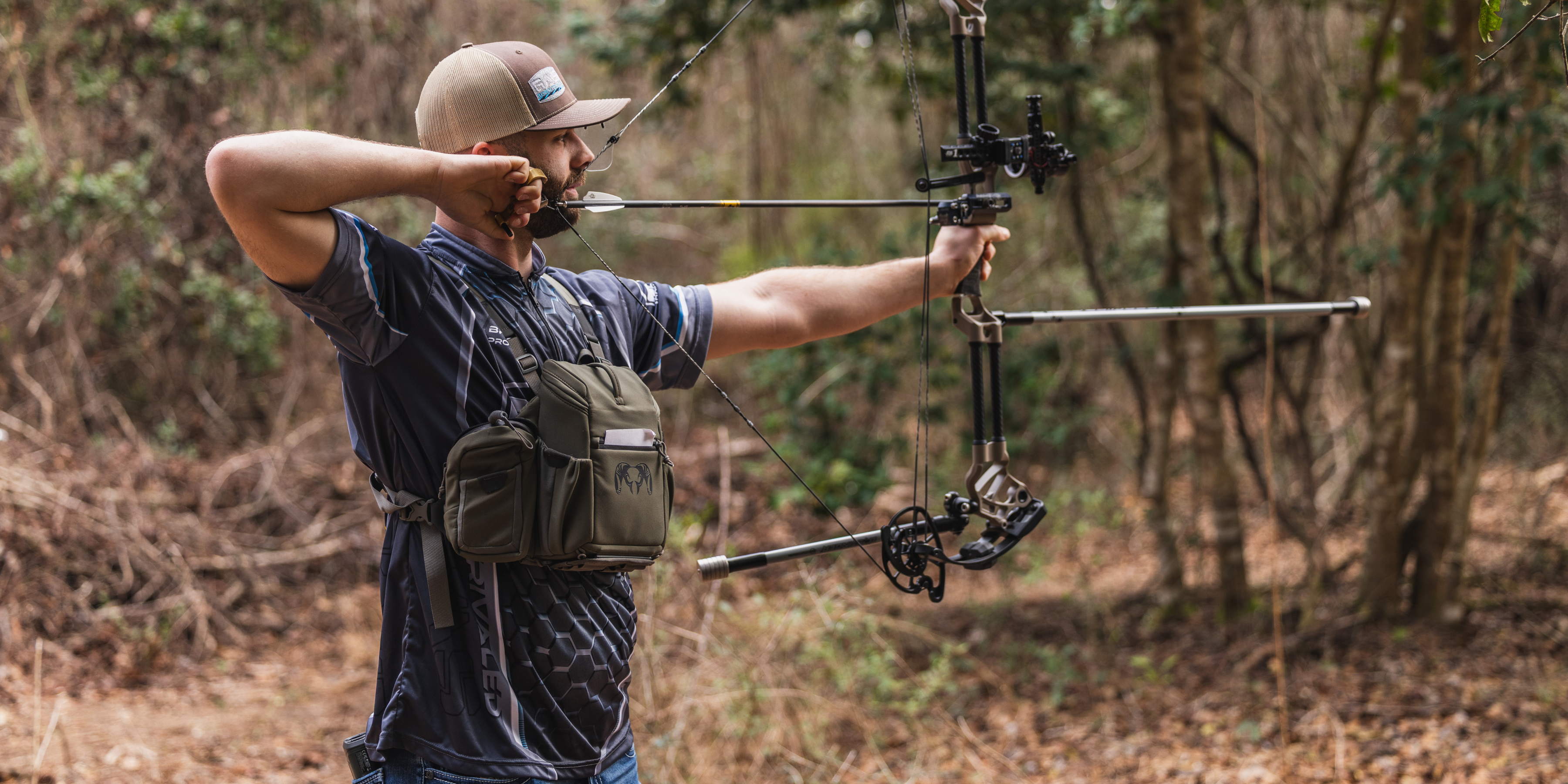 Archer shooting a compound bow at a 3D archery target with a bow stabilizer, demonstrating bow balance and stability for 3D and target archery with Bee Stinger equipment