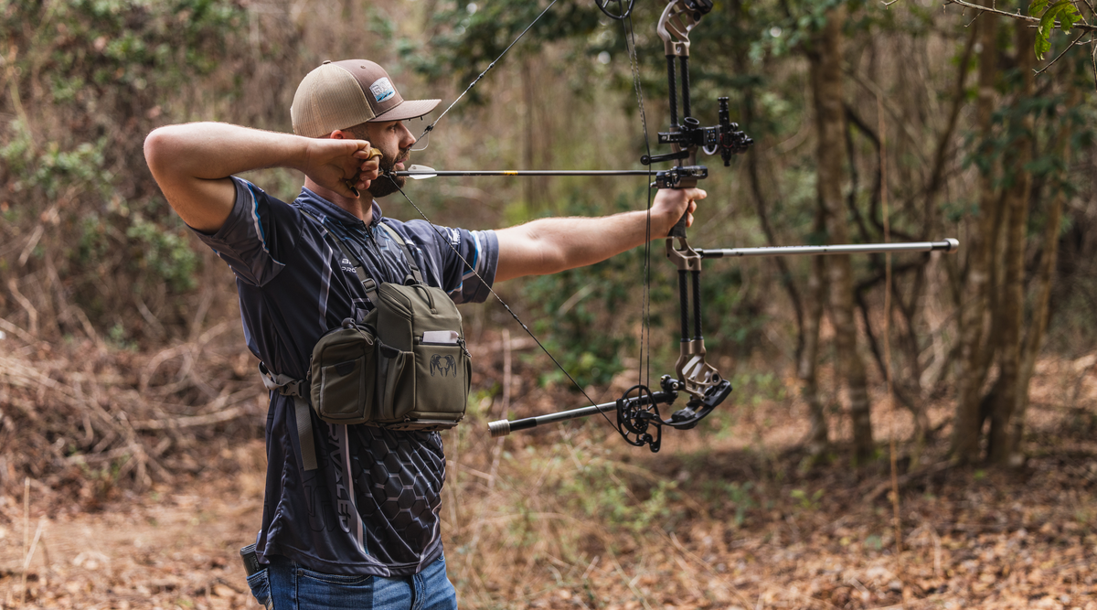 Archer shooting a compound bow at a 3D archery target with a bow stabilizer, demonstrating bow balance and stability for 3D and target archery with Bee Stinger equipment